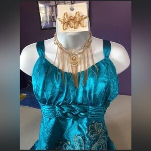 AM teal tank style top with gold accent necklace and gold hoops included